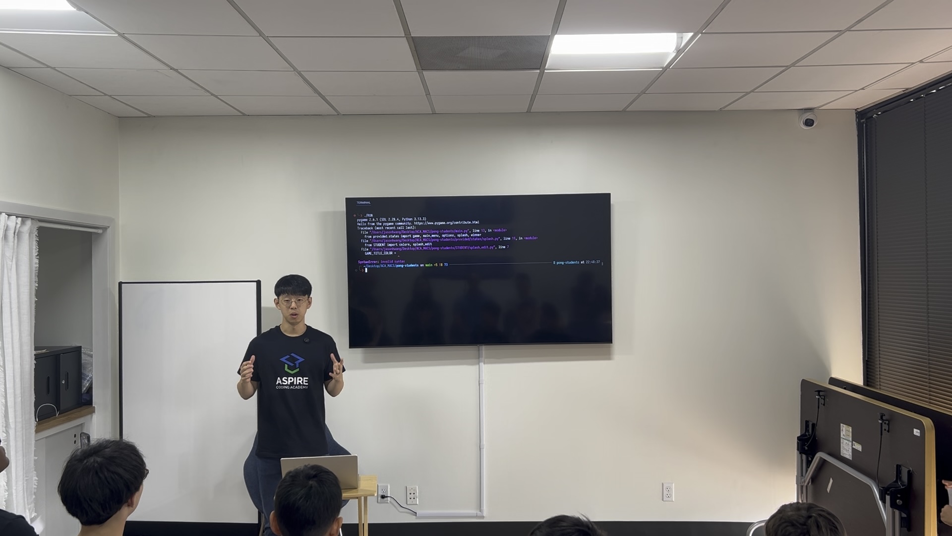 Jason teaching coding in a classroom.